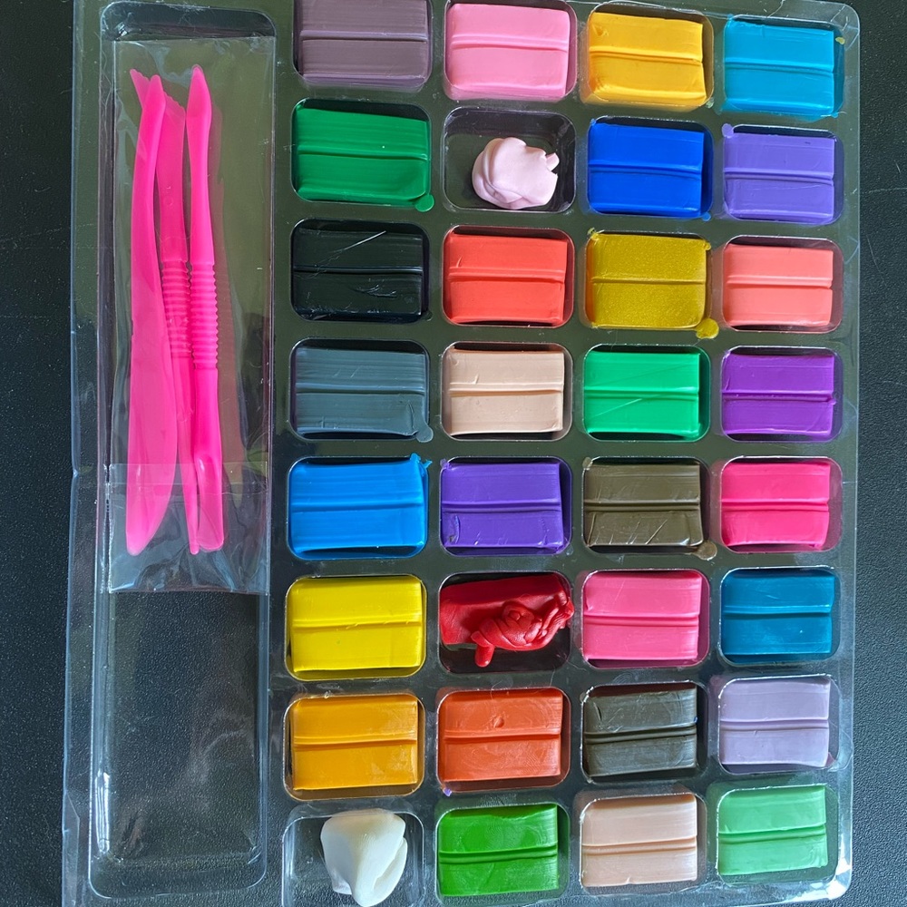 Polymer Clay. Some used other never touched. New set of tools that come with it.